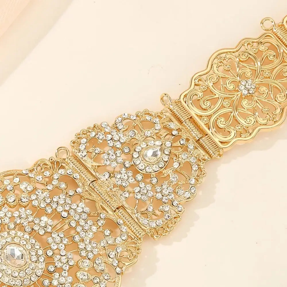 Ornate gold-tone metal Moroccan belt with rhinestones for elegant fashion styling