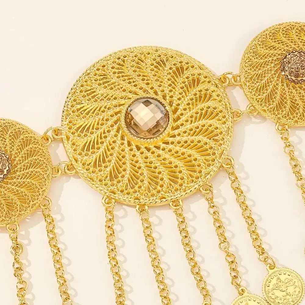 Gold-toned filigree waist belt with gem and coin charms for elegant accessories