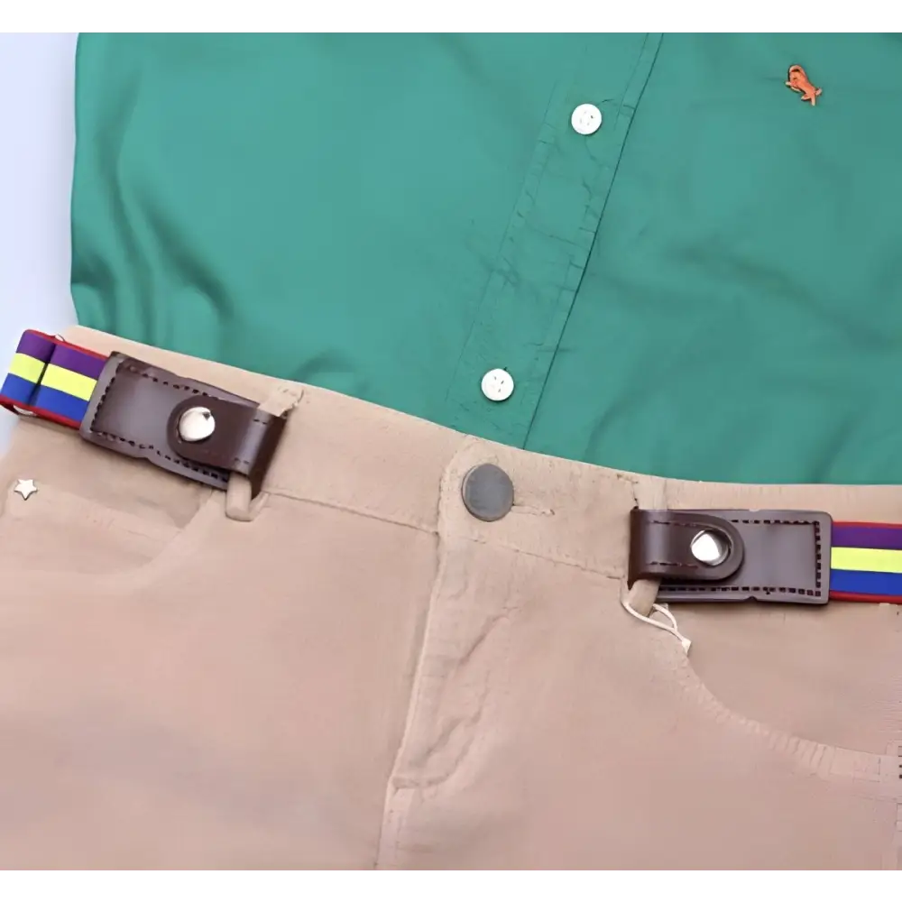 Tan pants with a colorful striped belt paired with a green shirt in the ensemble
