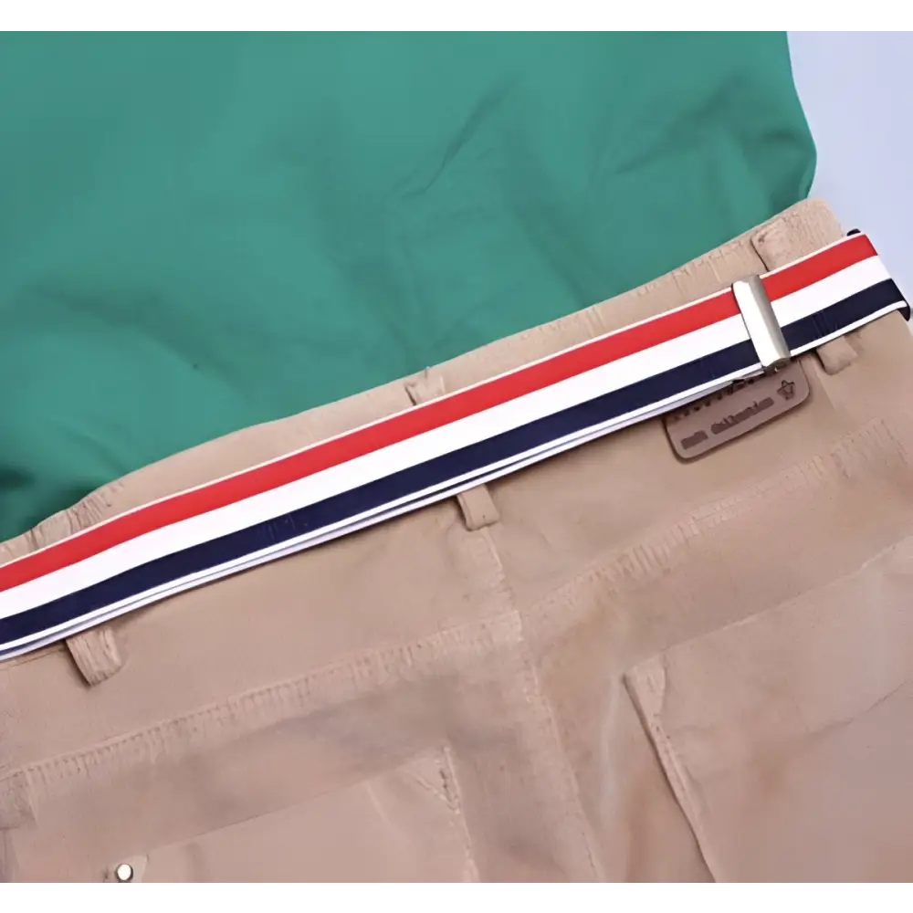 Khaki pants with striped belt paired with green shirt in a stylish ensemble