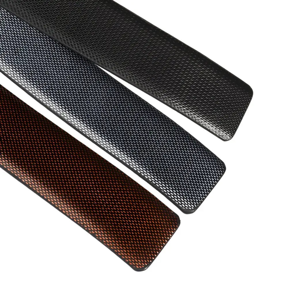 Textured leather strap belts in various colors featuring a coiled black leather belt with tang buckle