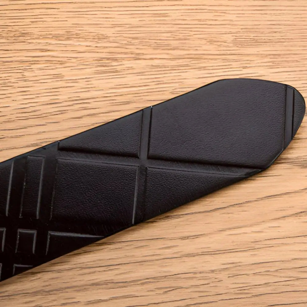 Black textured leather belt with patterned surface, stylish accessory for men and women