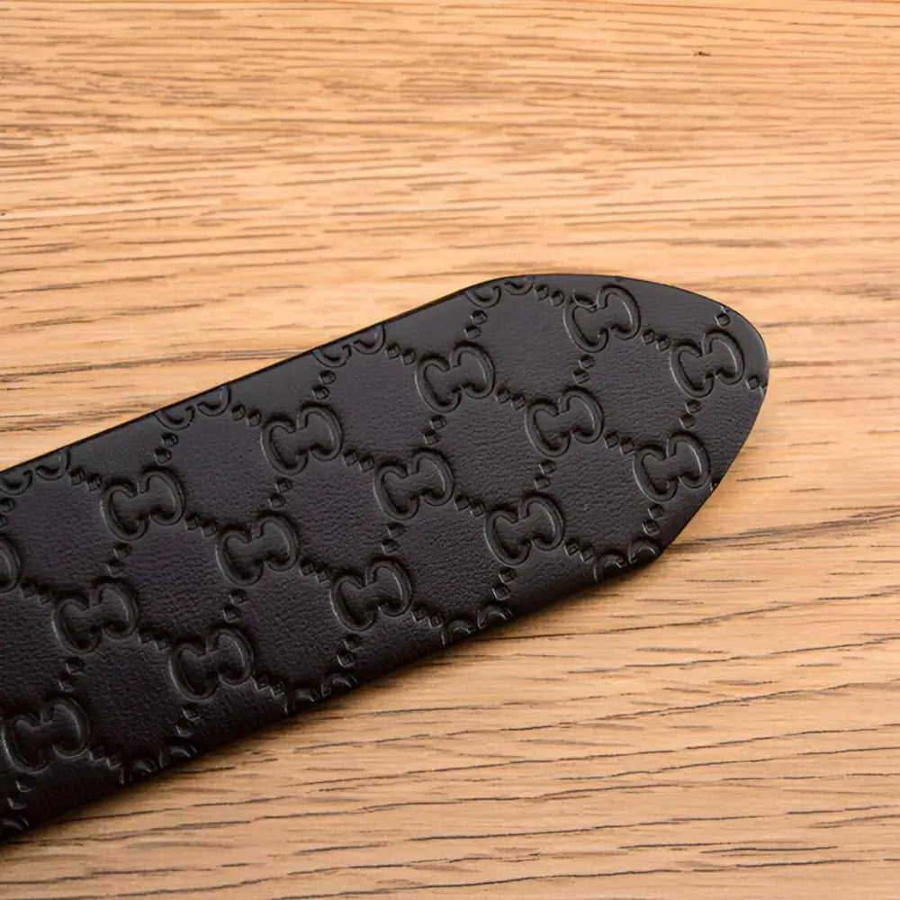 Myron Belt textured leather with repeating logo pattern for sophisticated style