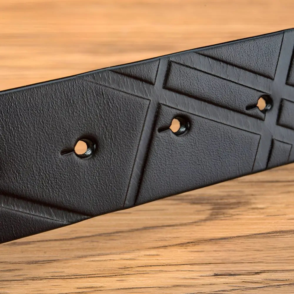 Black leather belt with geometric pattern and metal studs for stylish accessories