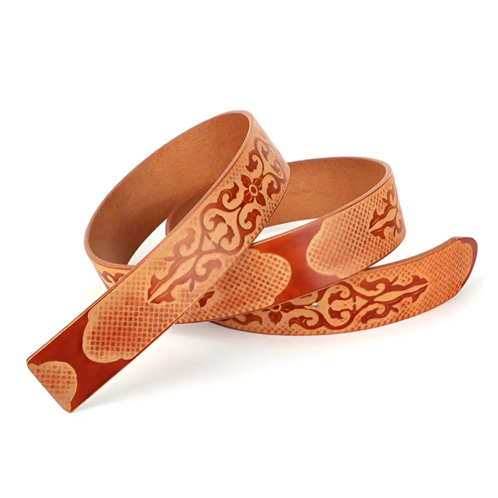 Embossed full-grain leather belt with decorative buckle for stylish accessory use