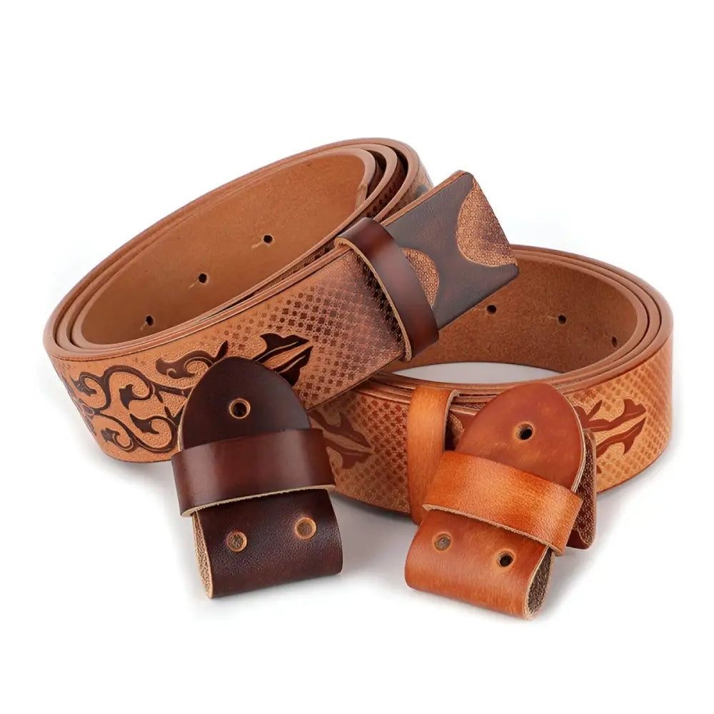 Embossed full-grain leather belt with patterned designs and decorative buckle display