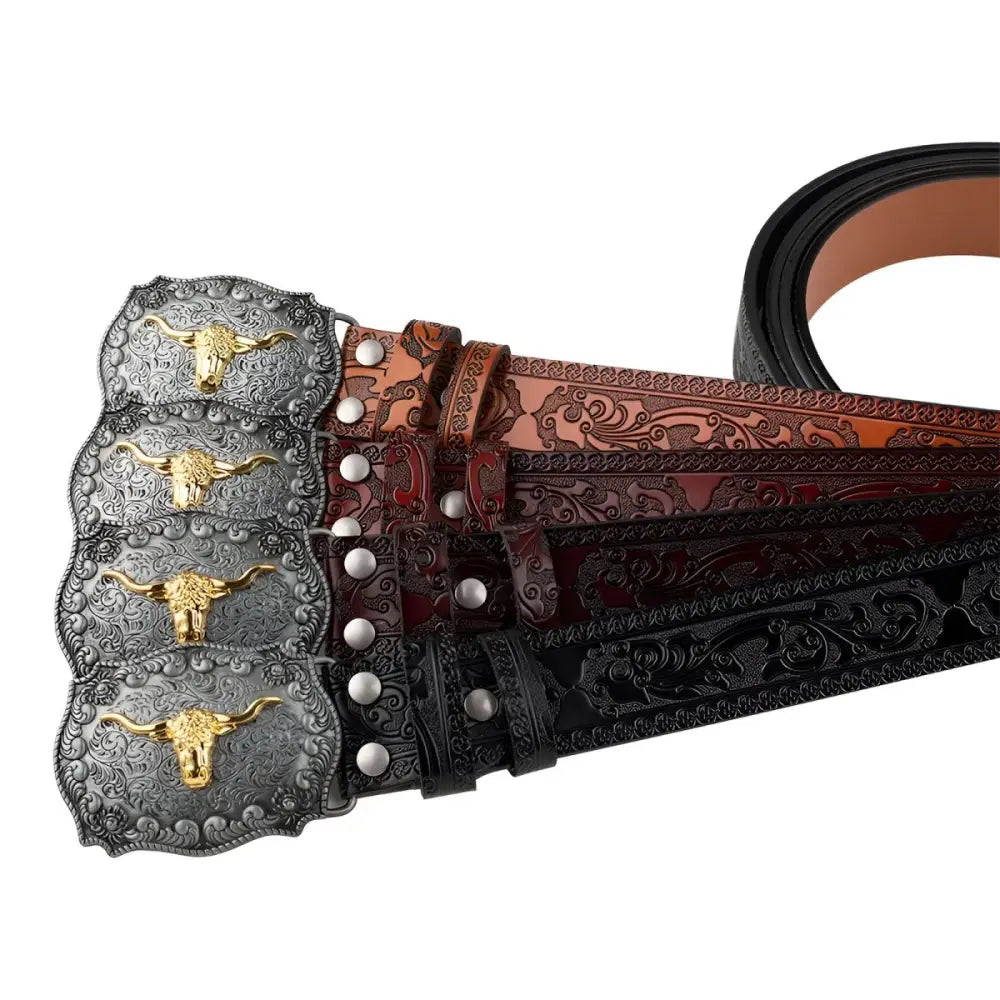 Assorted tooled leather belts with bull buckles from Black Patterned Ashtray and Embossed Leather Belts Set