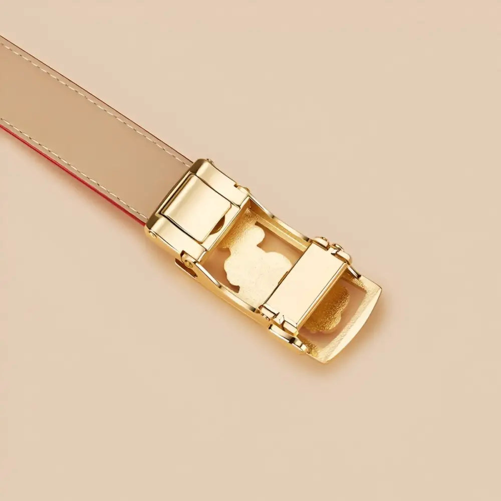 Gold-toned belt buckle with three flowers on a grained leather belt featuring a unique floral buckle