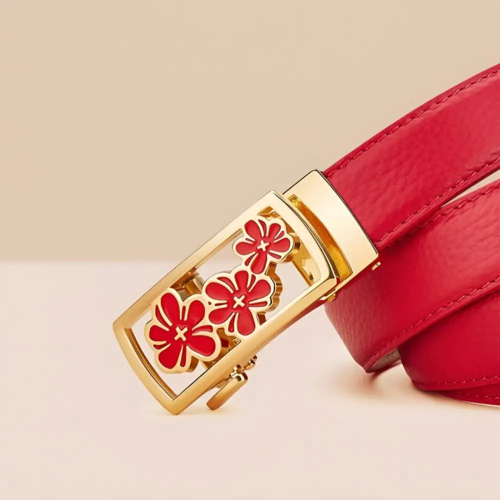 Red grained leather belt with a unique floral buckle featuring three flowers
