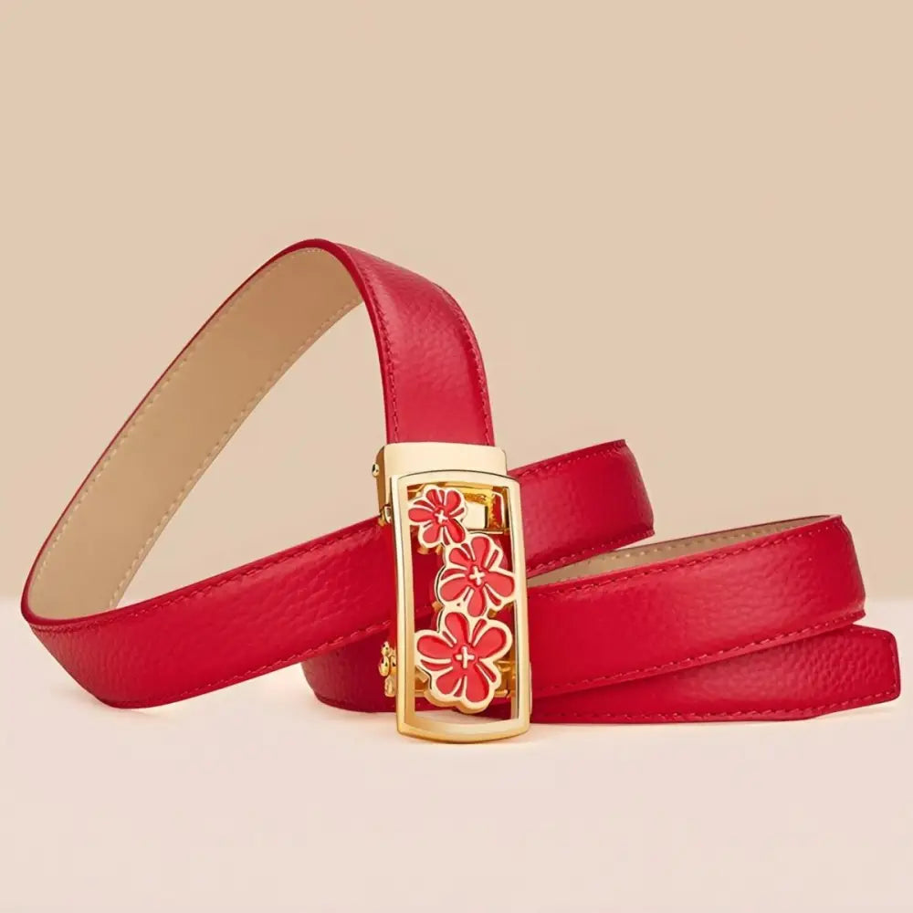 Red grained leather belt with a three flowers buckle featuring a unique floral design
