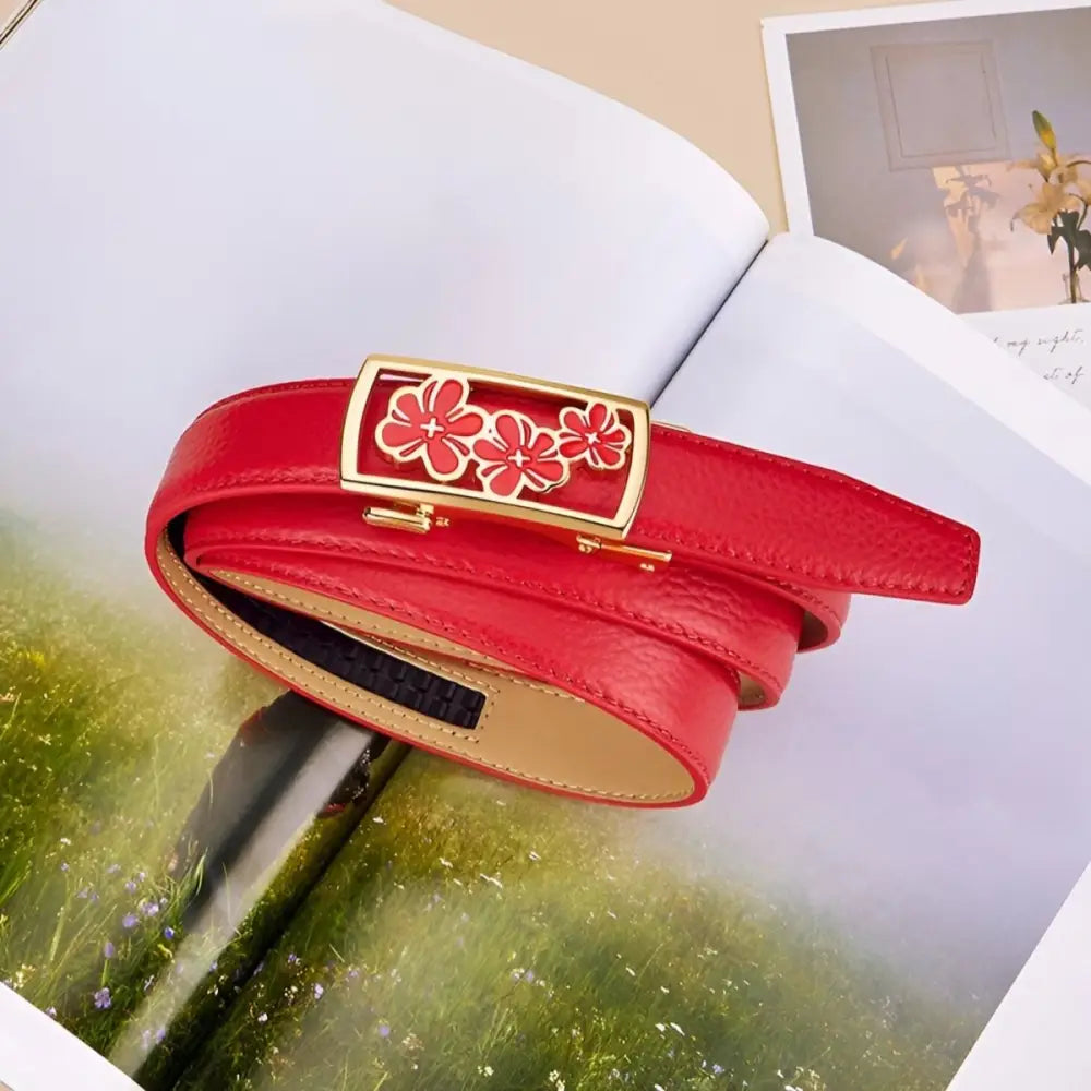 Red grained leather belt with a unique floral buckle featuring three flowers