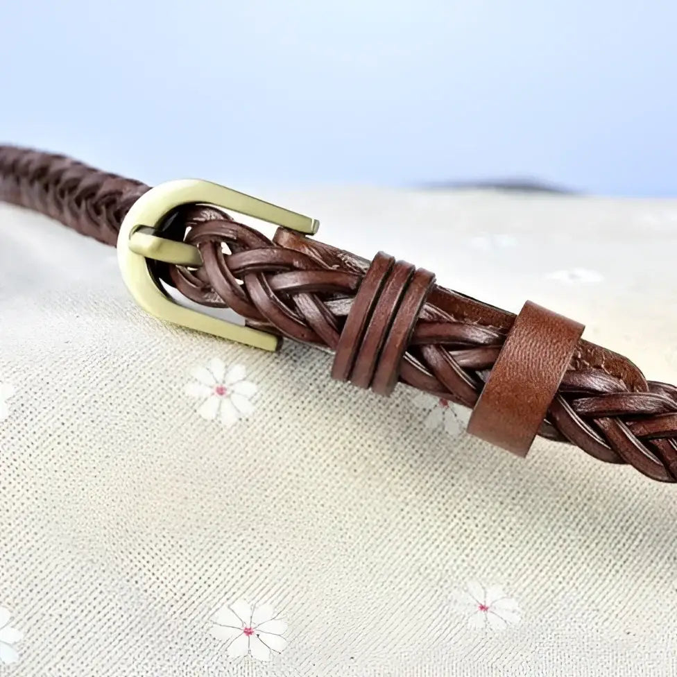Leather belt with braided design and brass buckle for elegant styling