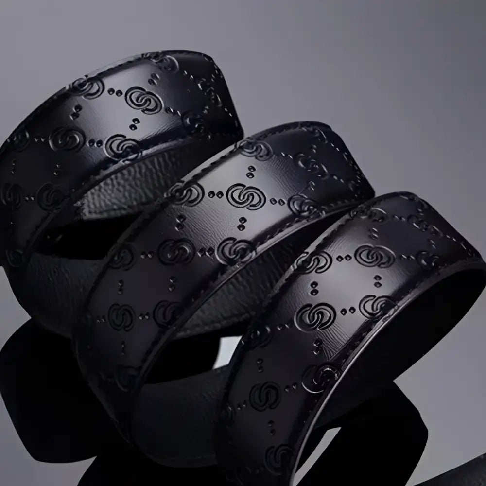Elegant black leather belt with embossed pattern and gold silver buckle for style