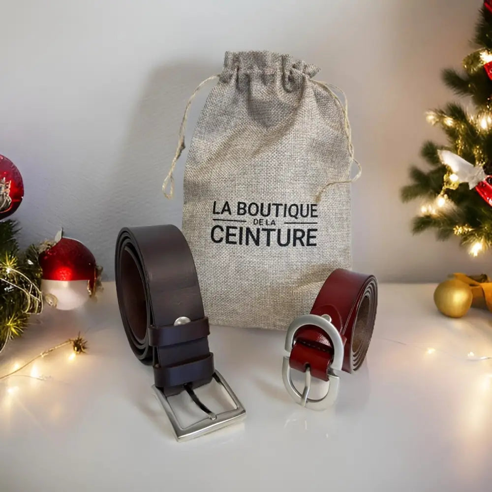 Leather belts with metal buckles displayed alongside a Burlap Gift Bag set