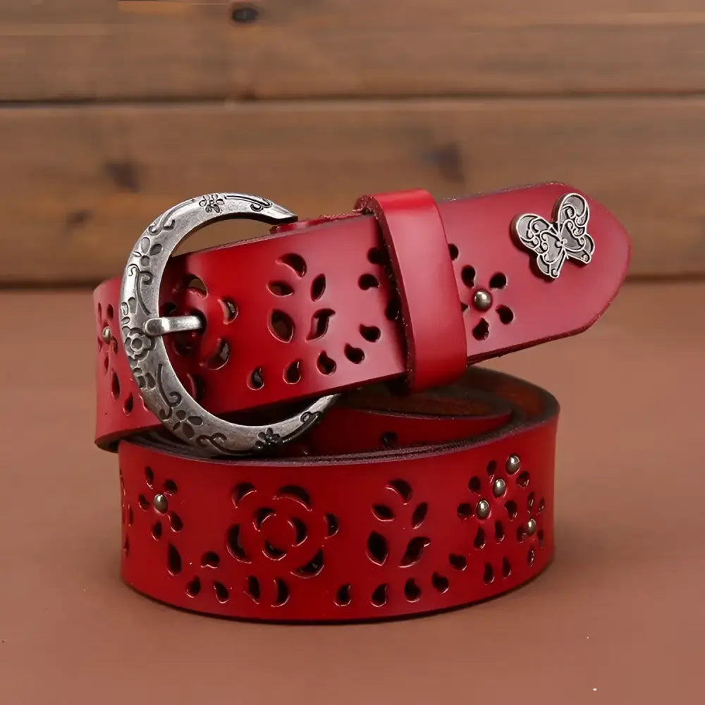 Red leather belt with floral cutouts and butterfly accent from Leather Belts with Decorative Buckles