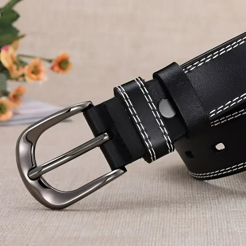 Black leather belt with silver buckle and multiple hole design for style and durability