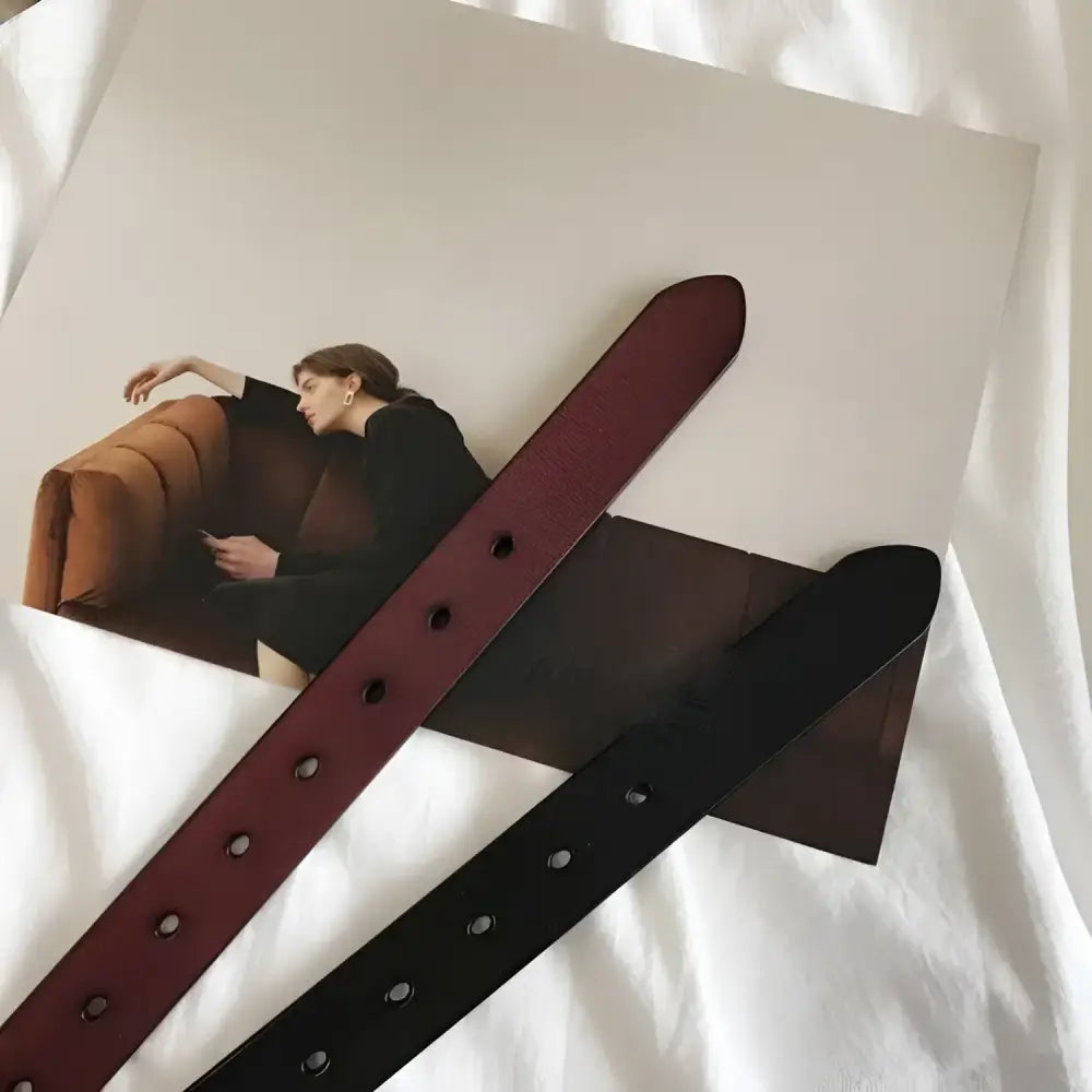 Image of two Menenba belts in black leather with gold buckles for women’s fashion