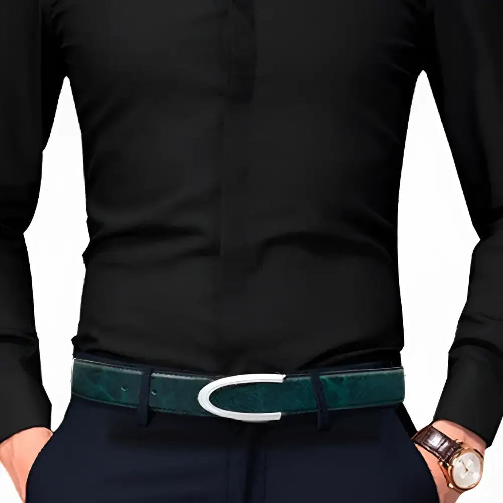 Men’s leather belt with gold and silver buckles worn with a black shirt and green belt