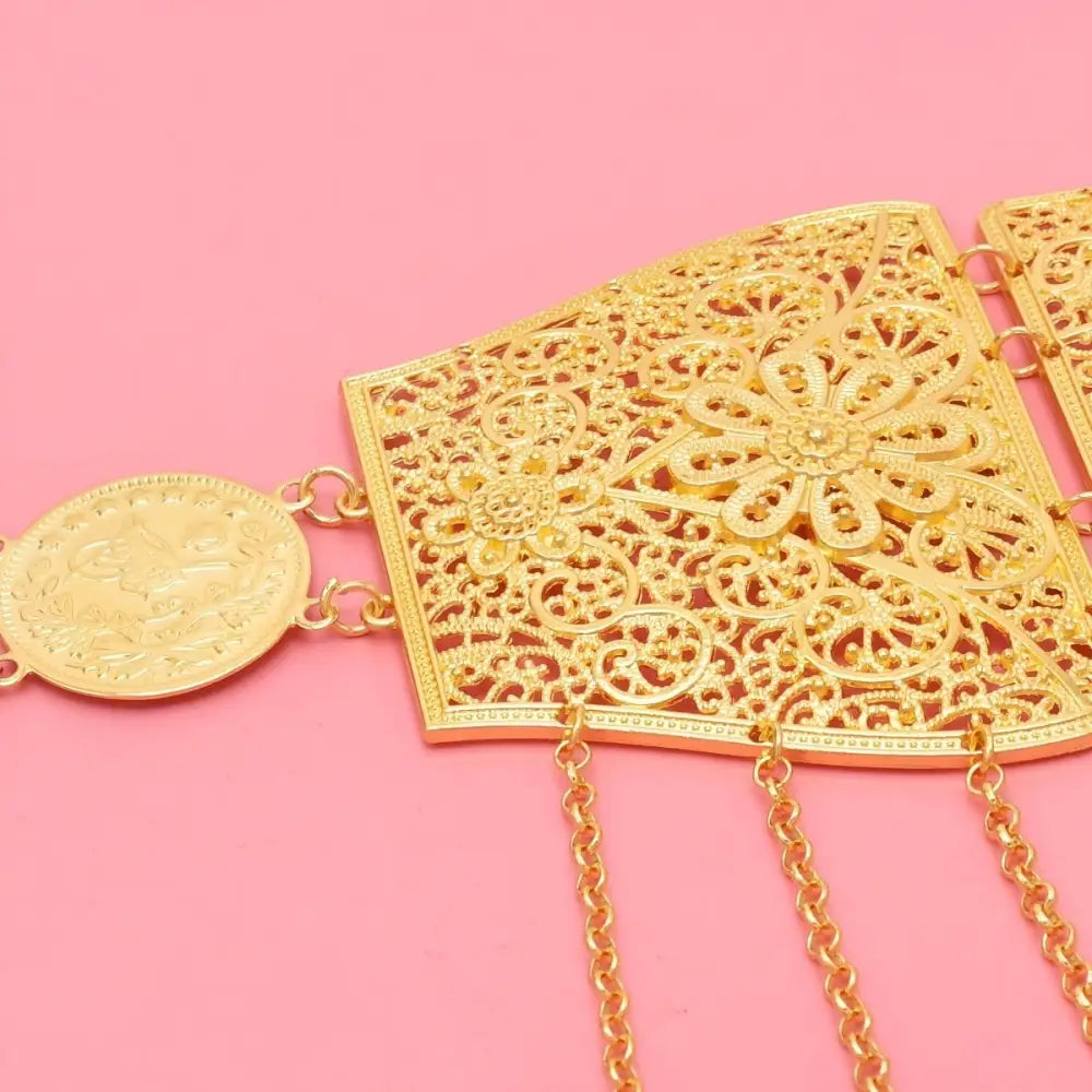 Elegant ornate gold-colored Moroccan belt with filigree and coin dangles for traditional style
