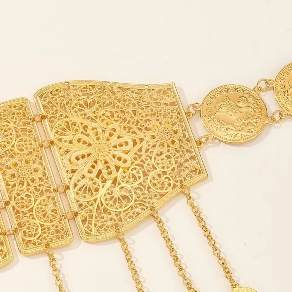 Ornate gold-toned Moroccan belt with intricate filigree and coin dangles