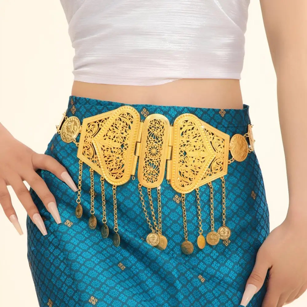 Ornate gold belt with intricate coin dangles in a luxurious jewelry display