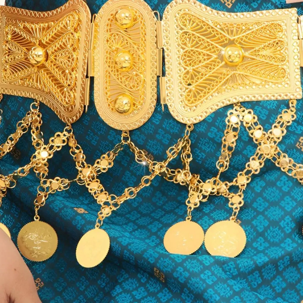 Ornate gold belt with dangling coin pendants displayed on the product Ornate Gold Coin Belt with Dangling Coins