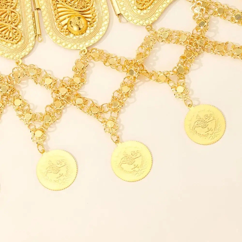 Ornate gold coin belt with dangling coins showcased in a luxurious product display