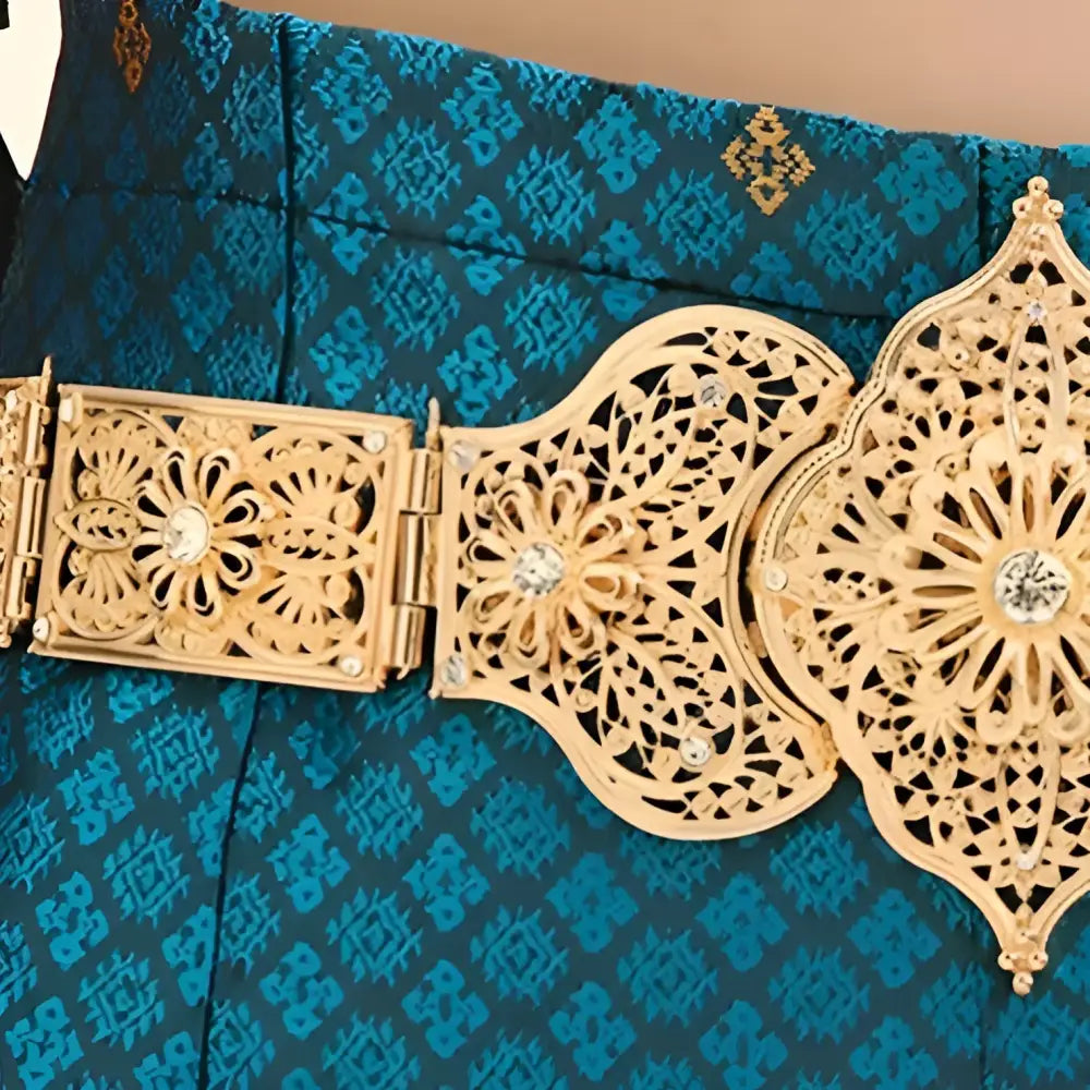 Ornate gold metal belt showcasing intricate detailed craftsmanship and luxurious design