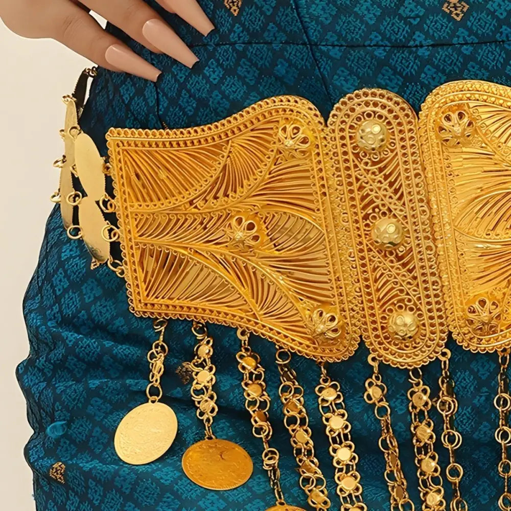 Ornate gold Moroccan belt with intricate designs and blue fabric for belly dance performances