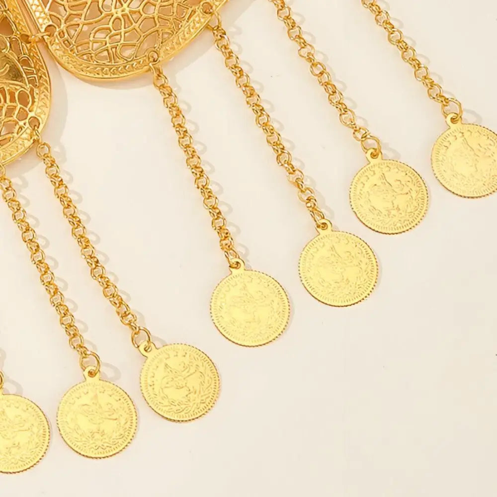 Gold-colored coin-dangling jewelry on the Ornate Haniya Belt with Gold Coins and Filigree detailing