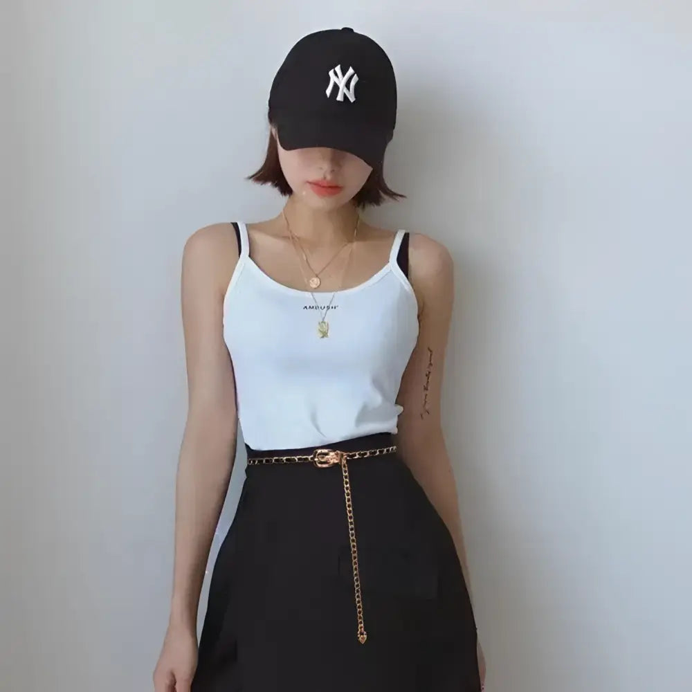 Woman wearing PrayOppé Model Black Blazer with Gold Chain Belt and Baseball Cap