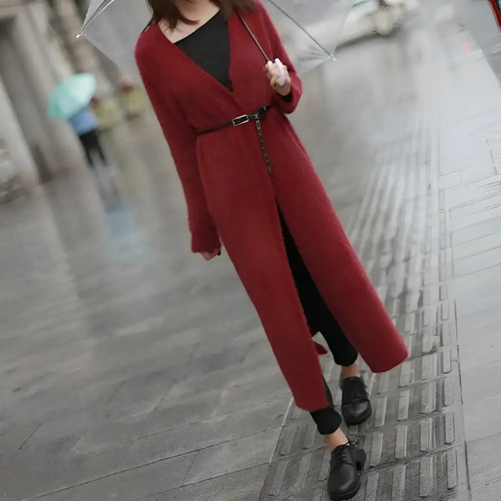 Long red belted cardigan paired with genuine leather belt with silver buckle for elegant style