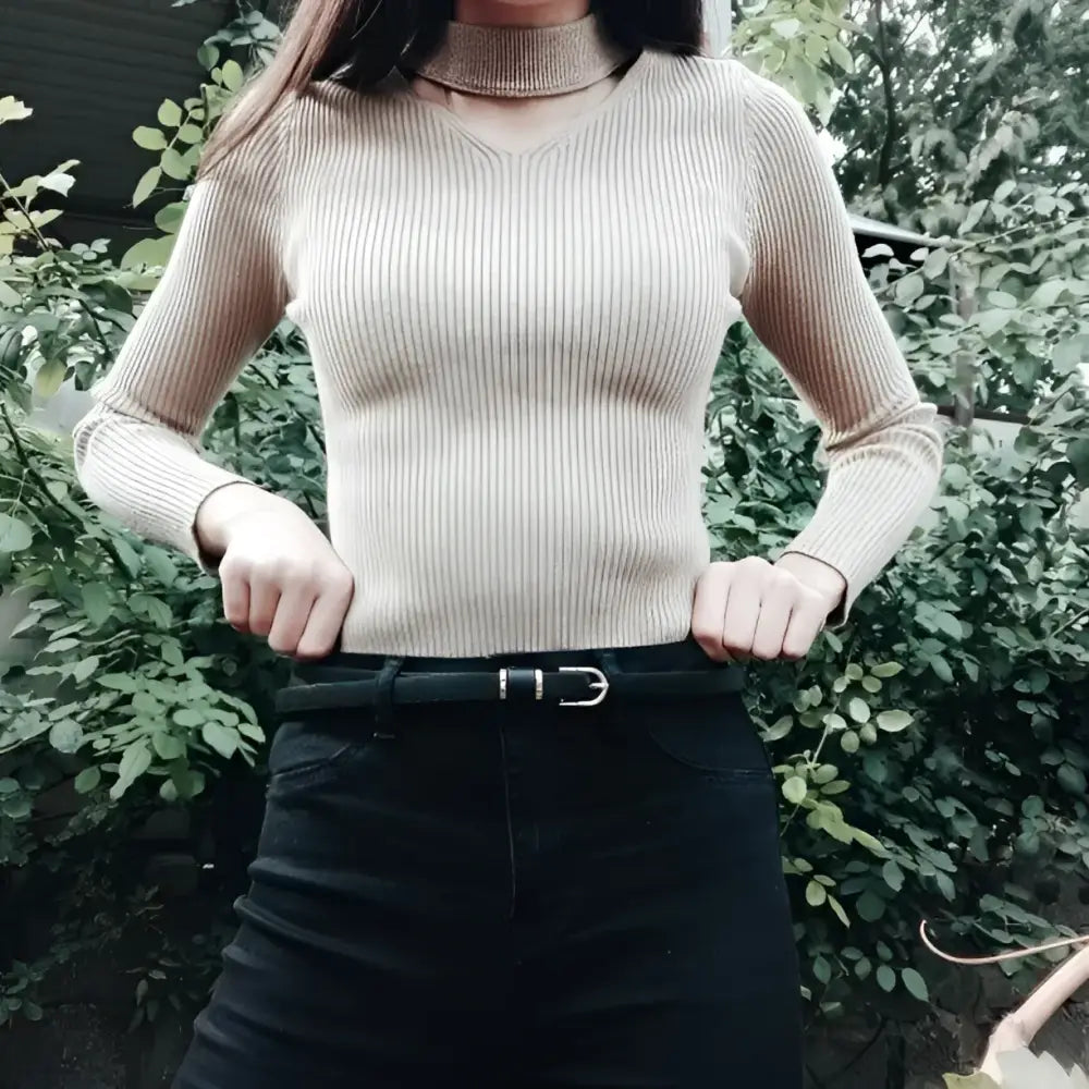 Roxane Leather Belt paired with ribbed beige choker-neck sweater for elegant style
