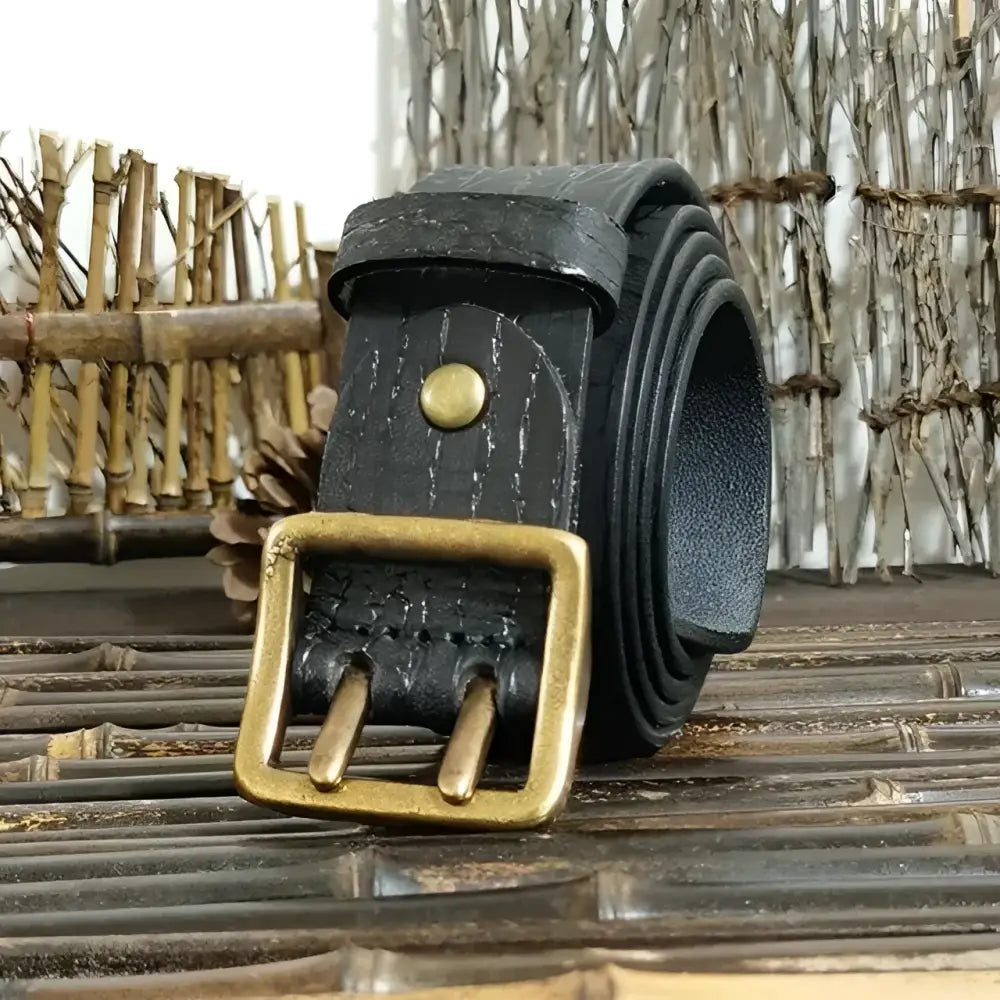 Set of four black leather belts with brass buckles for stylish men’s accessories