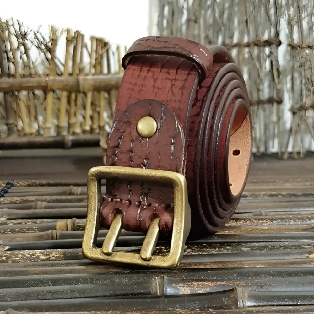 Rolled brown leather belt with brass buckle from Set of Four Leather Belts