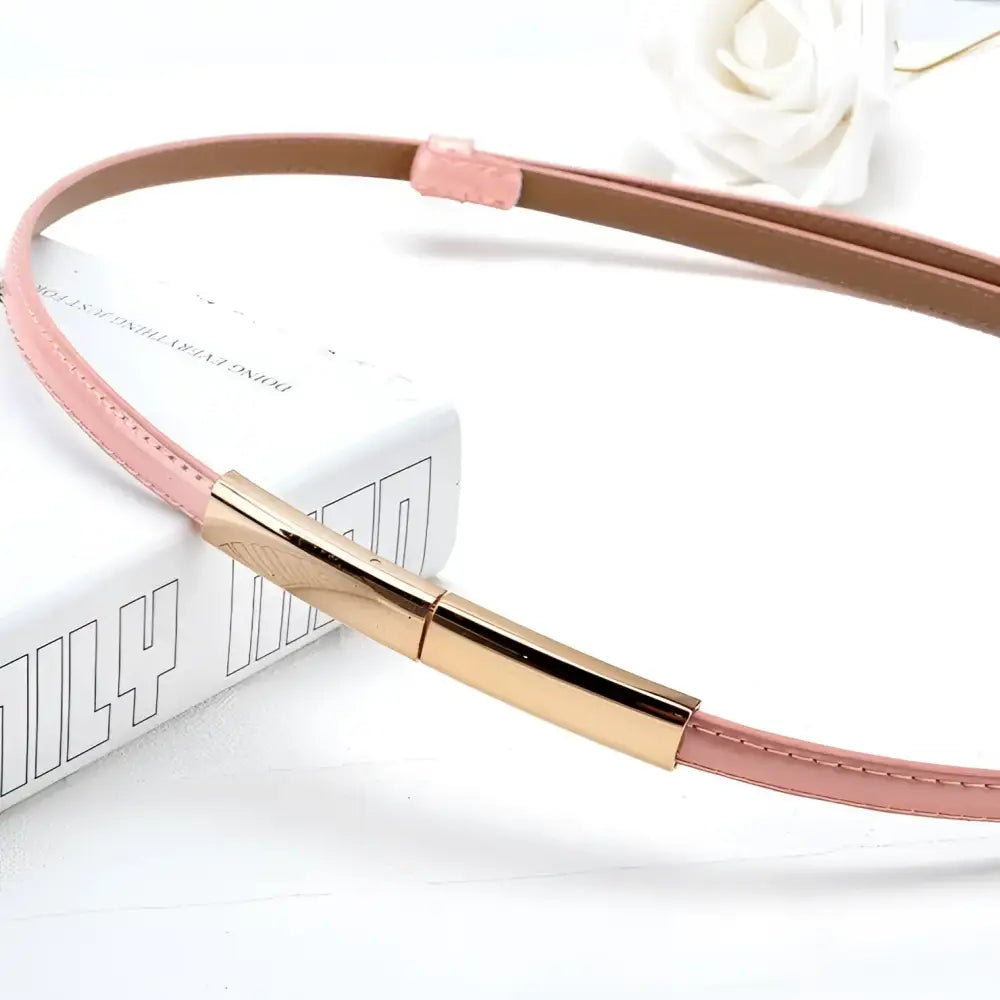 Pink leather belt with a gold buckle from the Stacked Patent Leather Belts collection