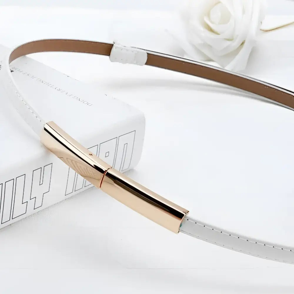 White leather belt with gold buckle from the Stacked Patent Leather Belts collection