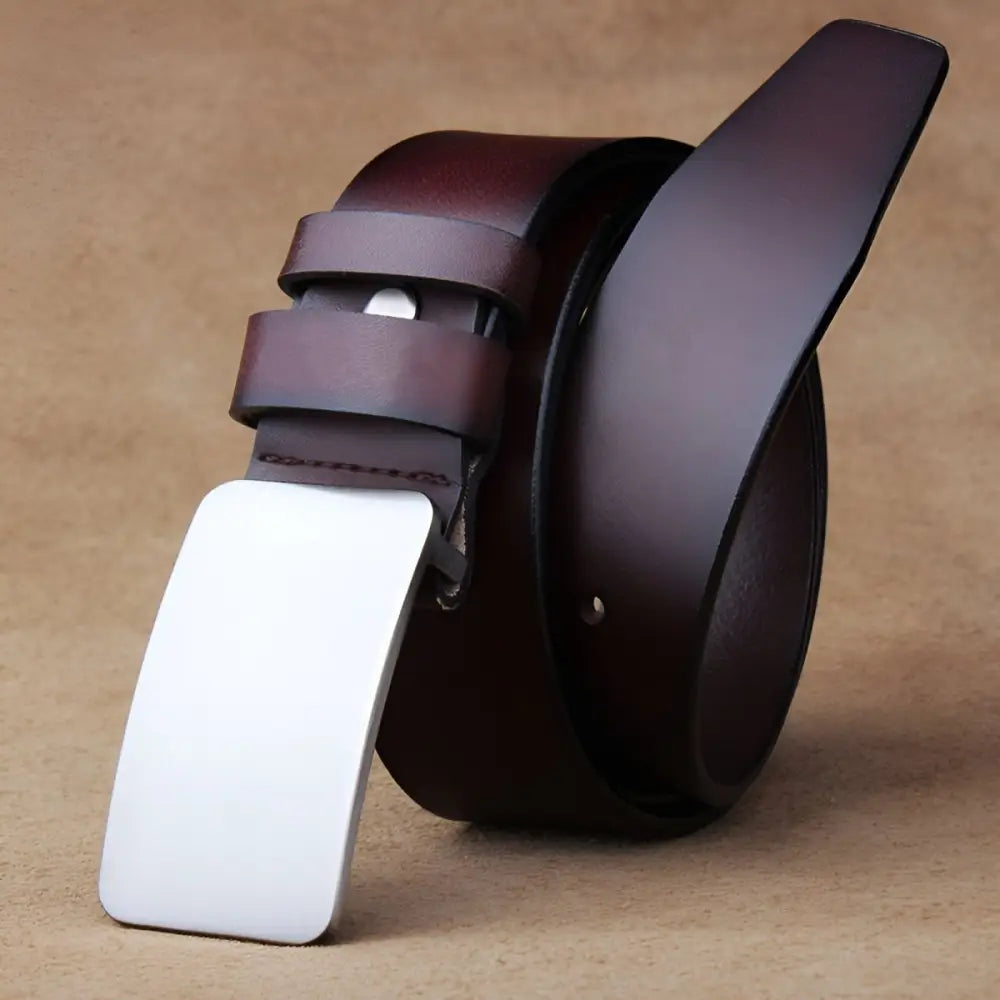 Full-grain leather belt with silver buckle showcasing durable brown leather craftsmanship
