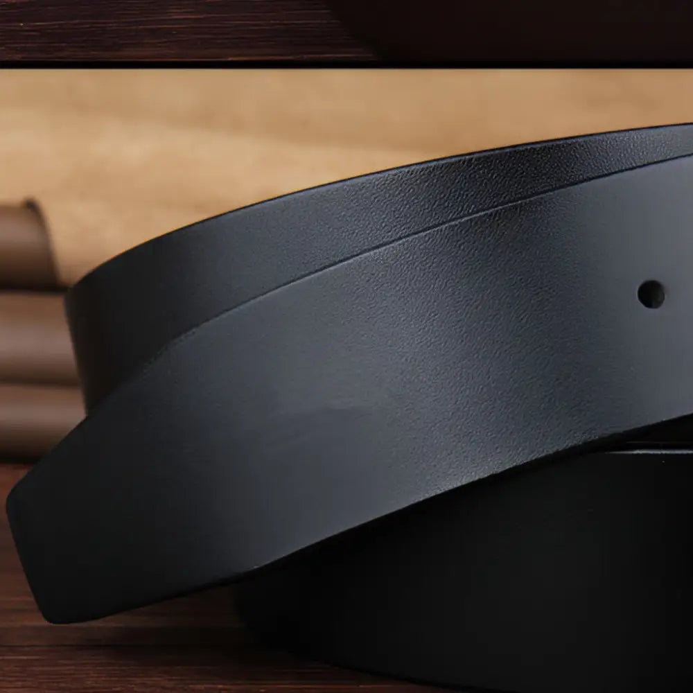 Black full-grain leather belt with silver buckle for mens formal fashion