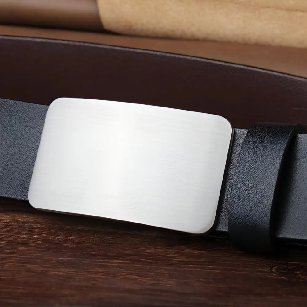 Black full-grain leather belt with silver buckle for men’s formalwear