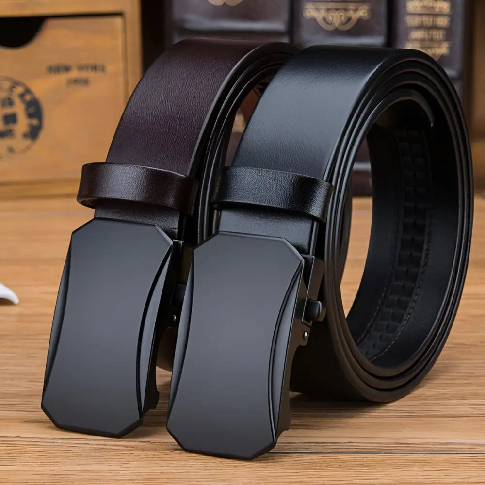 Two full-grain leather ratchet belts with metal buckles displayed for the Black Full-Grain Leather Ratchet Belt product