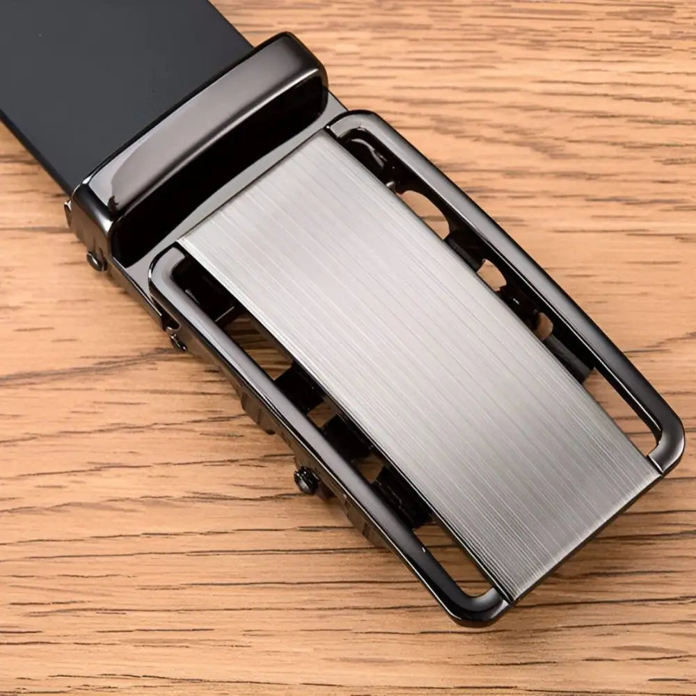 Metal belt buckle on black grain leather belt for men, stylish and durable accessory