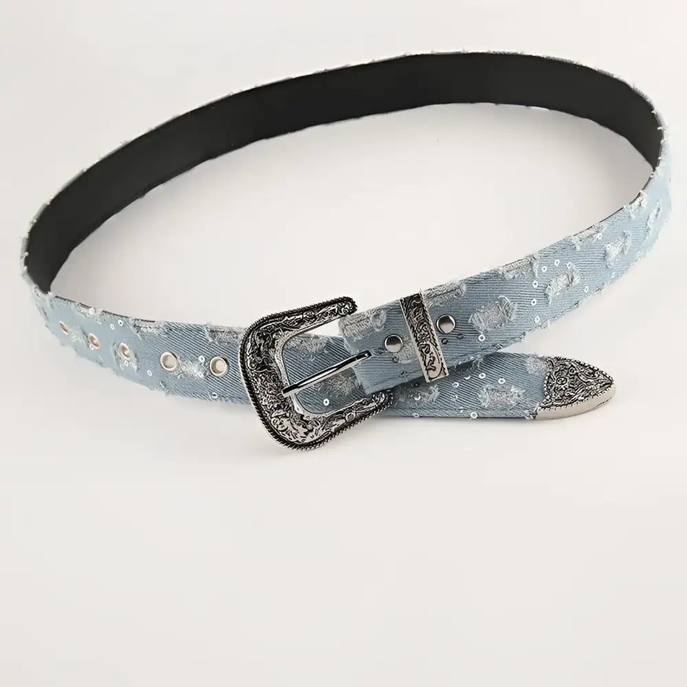 Light blue denim belt with decorative buckle, complements ripped jeans style in product image