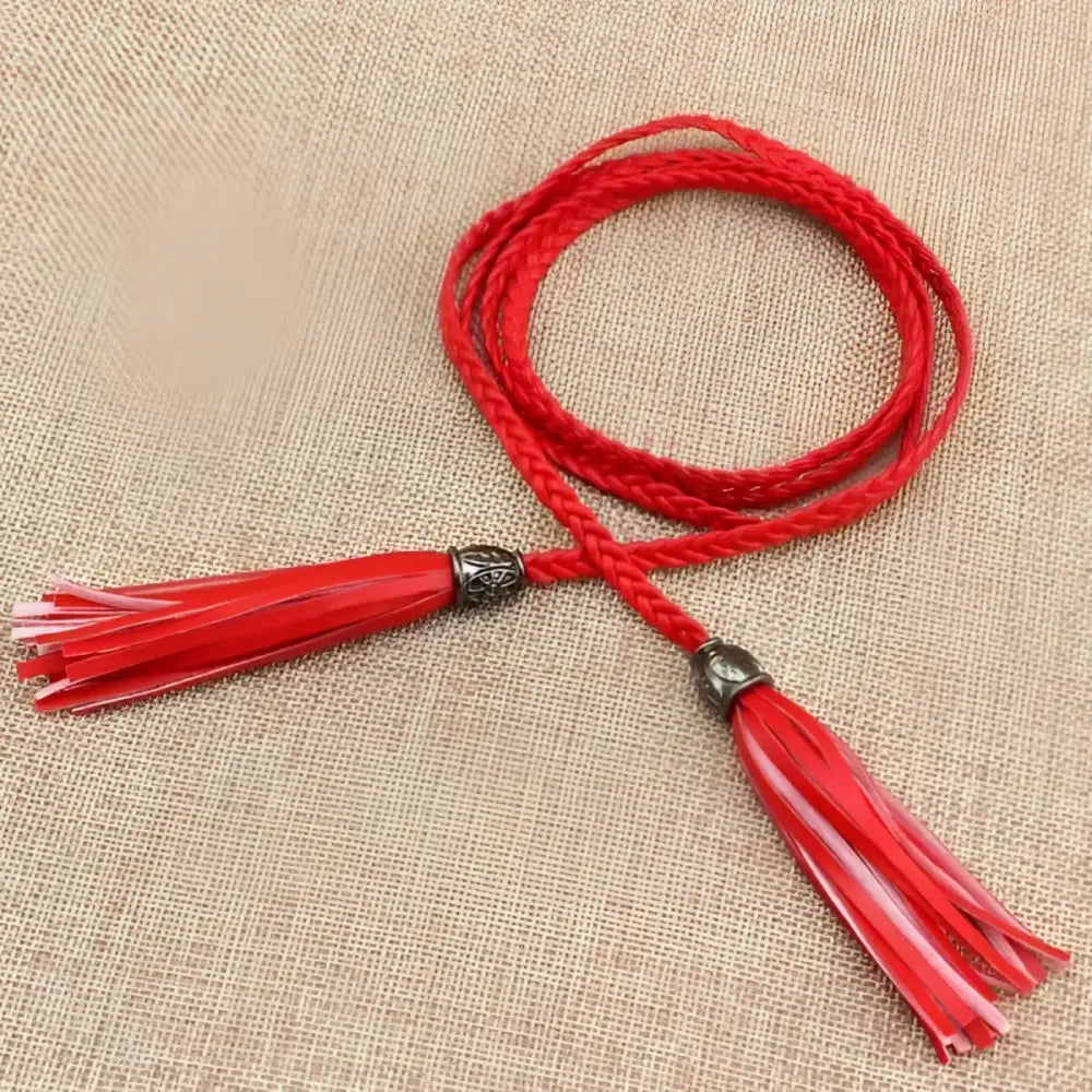 Red braided tumunia model tie belt with tassel detailing for women
