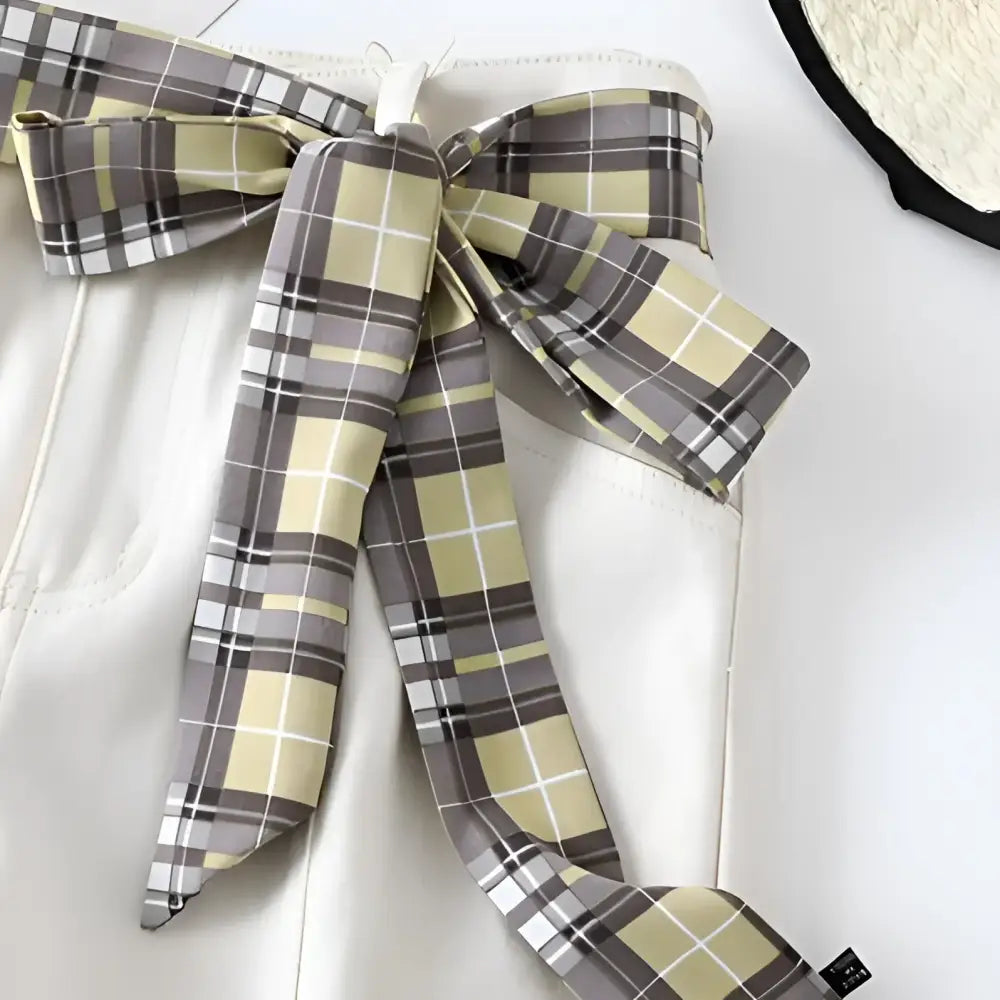 White pants with plaid scarf belt and tie details for stylish modern fashion