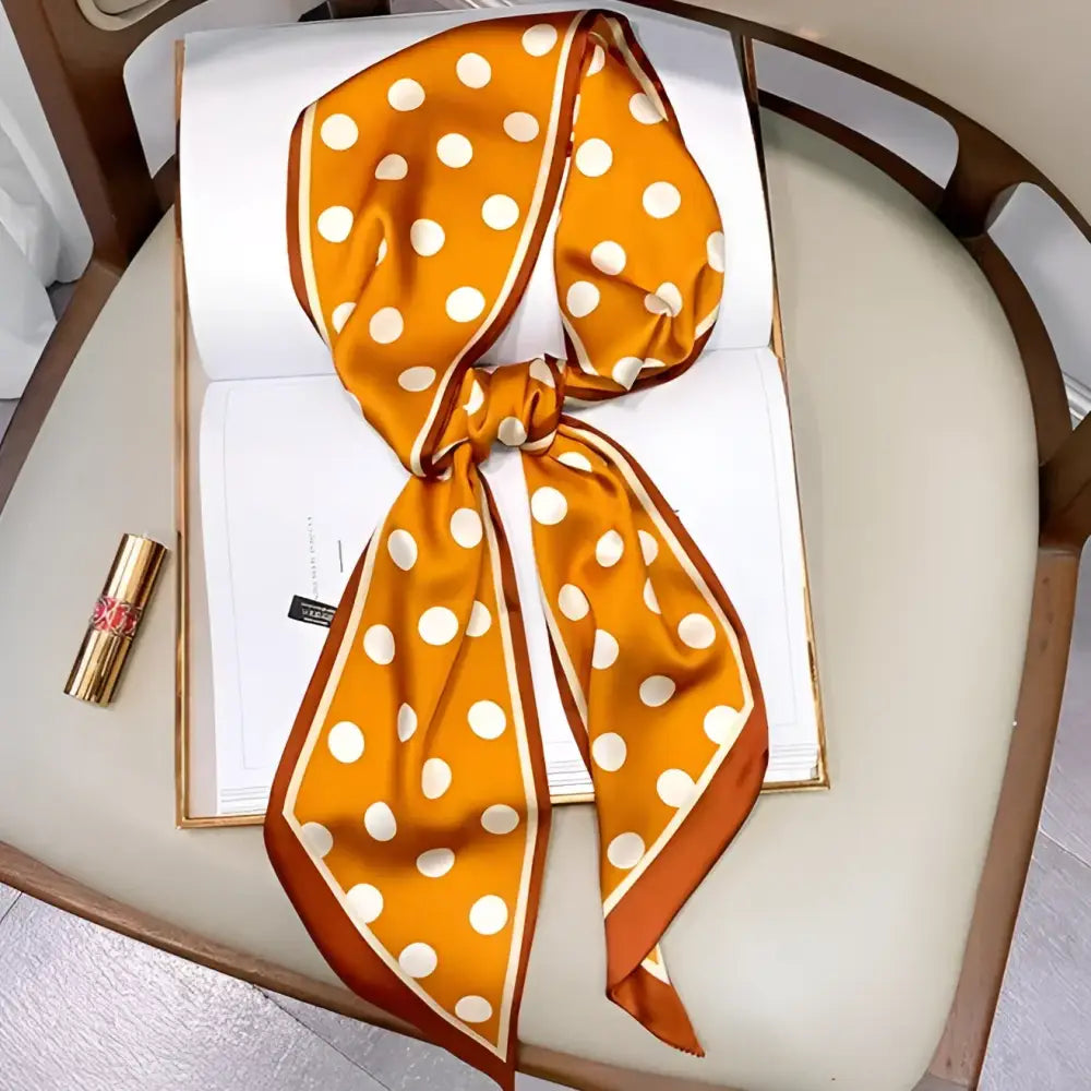 Orange polka dotted silk scarf-belt paired with White Shorts