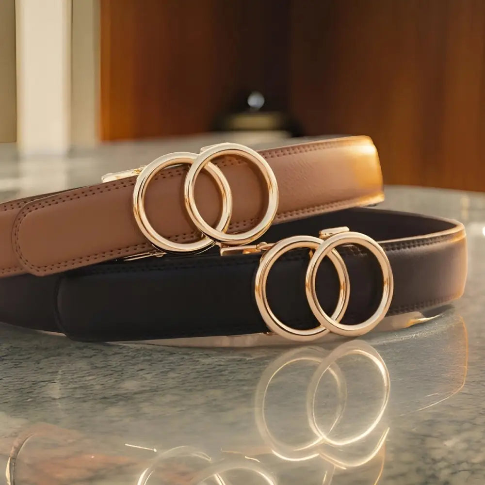 Leather belts with interlocking circle buckles worn by woman in black tank top white pants and olive-green shirt