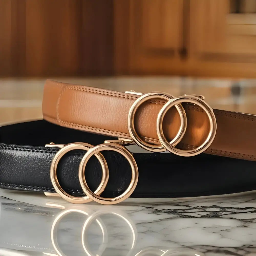 Leather belts with interlocking gold circle buckles worn with black tank top white pants and olive-green shirt
