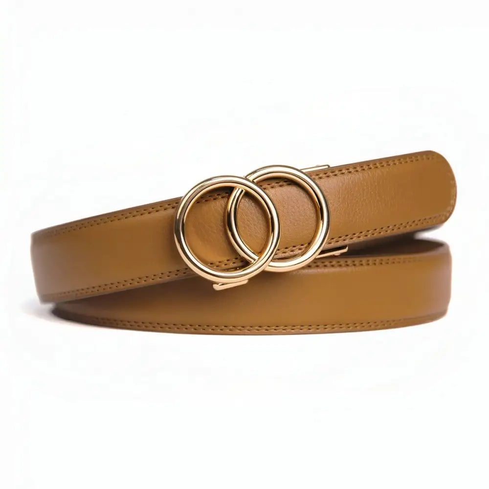 Brown leather belt with interlocking gold circles worn by woman in black tank top white pants and olive-green shirt