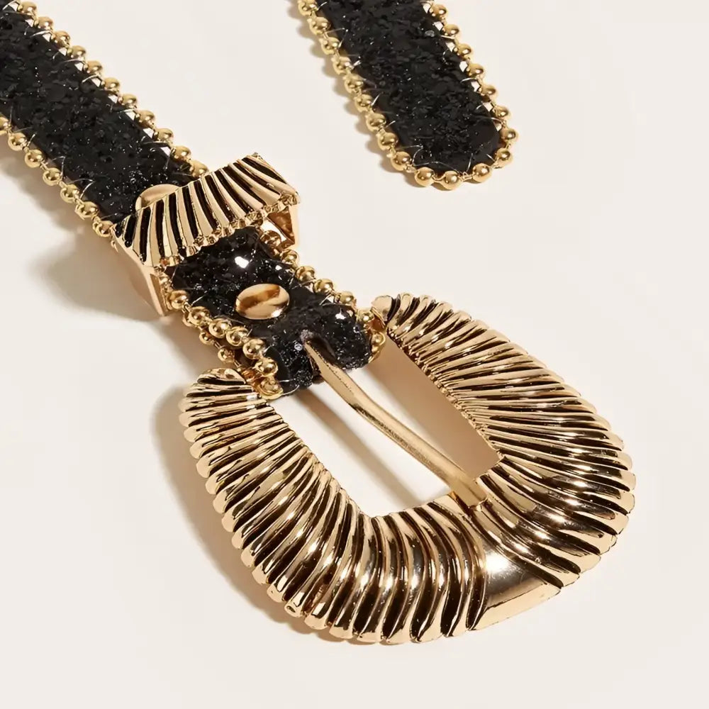 Black and gold textured belt with ornate gold buckle from Yerema Western Rhinestone collection